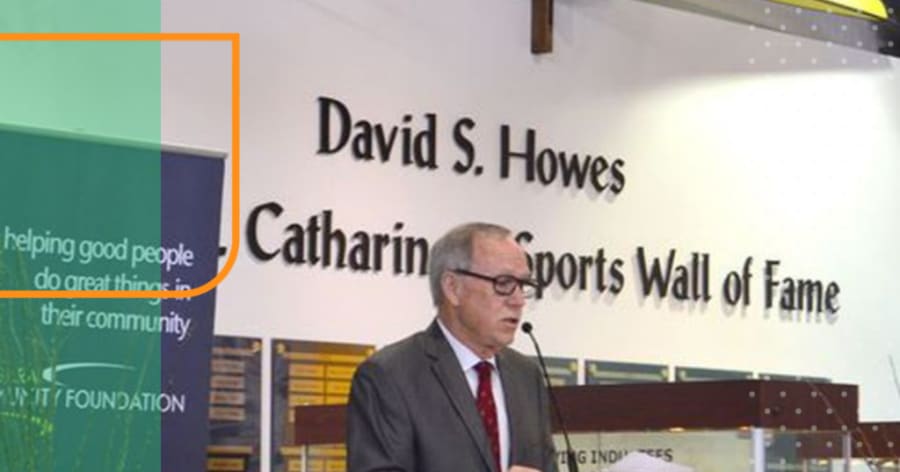 A representative from the David S. Howes Foundation speaks at a podium.