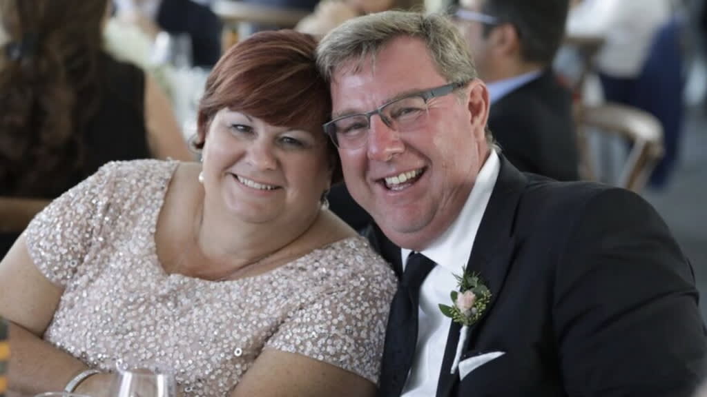 Judy and Tony posing for a portrait.