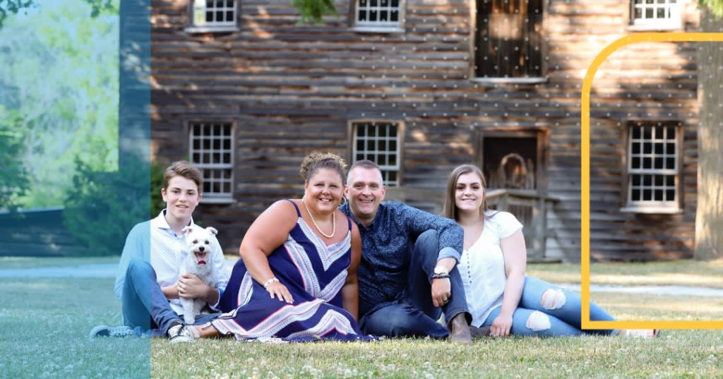 Wade Stayzer and family posing for portrait with their dog.
